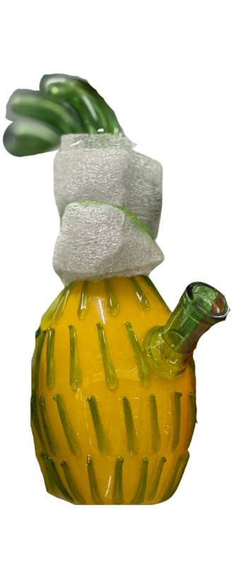 Glass object in the shape of a pineapple with green accents, possibly used as a decorative item or functional glassware, available at your local vape store.